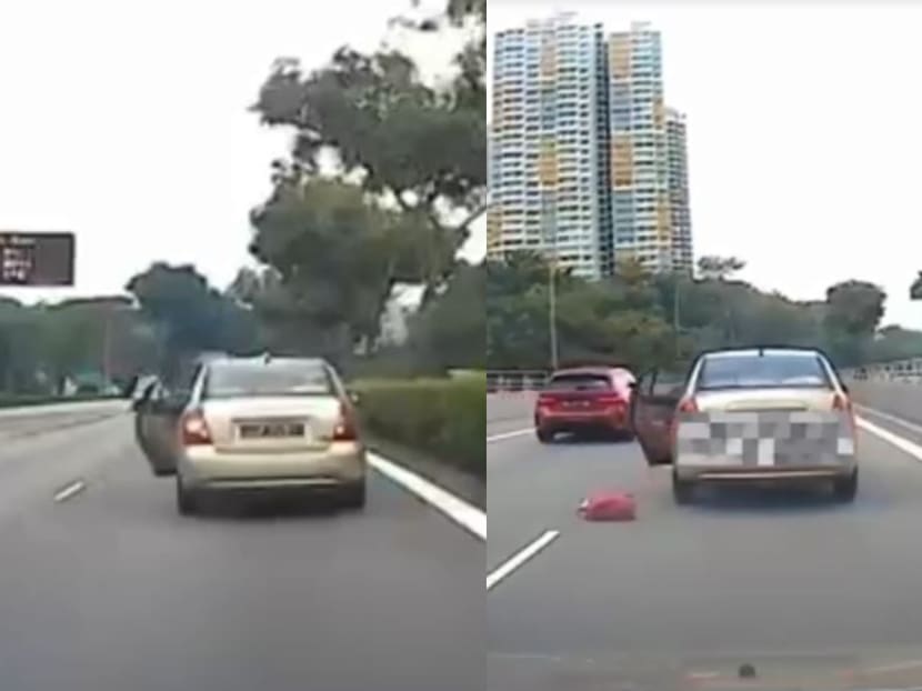 Dashcam footage of the incident — which was posted on Chinese language news portal 8World News — shows a champagne-coloured Hyundai cruising on the expressway with its left passenger door ajar. A red handbag was then thrown onto the tarmac, with its content spilling out.