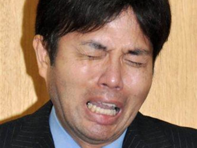 Hyogo Prefectural assemblyman Ryutaro Nonomura cries during a press conference in Kobe, western Japan. Photo: AP