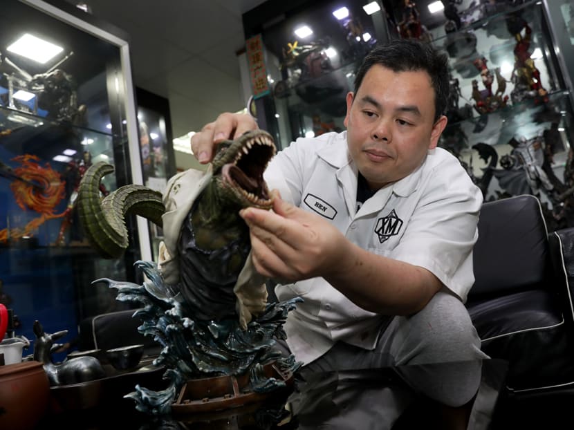 Mr Ben Ang, chief executive officer of XM Studios, with one of the collectibles that the firm sells around the globe. Mr Ben Ang, chief executive officer of XM Studios, with one of the collectibles that the firm sells around the globe.