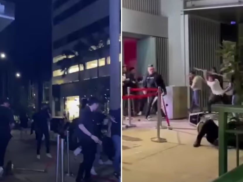 Still images of a May 7 brawl taken from a series of videos posted by a Facebook user. The footage shows a fight between staff members of nightclub Cherry Discotheque and a group of customers outside the club's entrance on Cecil Street.