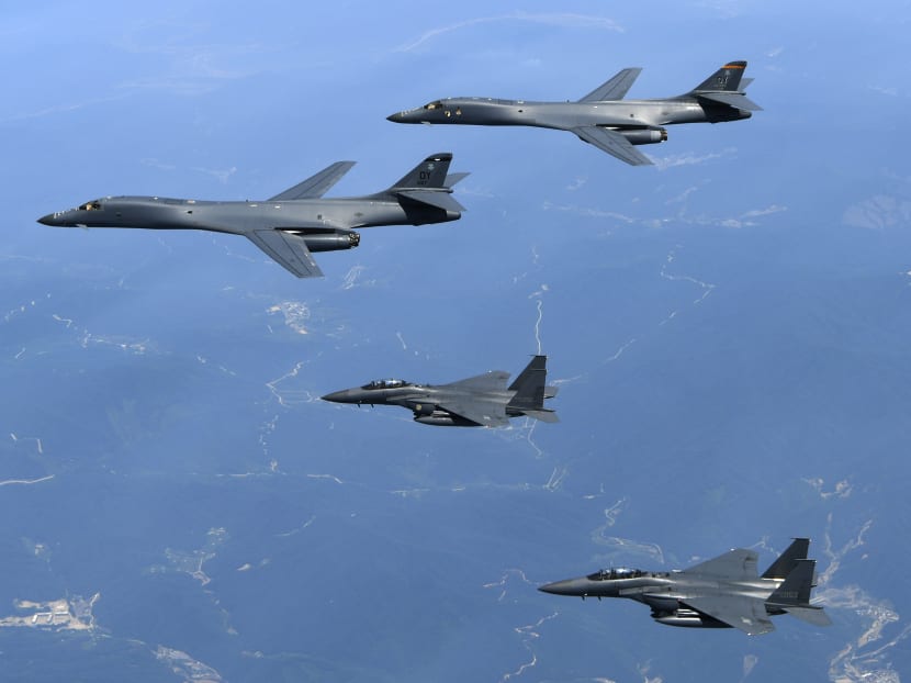 In this June 20, 2017 file photo provided by South Korean Defence Ministry, American Air Force B-1B bombers, top, and second from top, and South Korean fighter jets F-15K fly over the Korean Peninsula, South Korea. Source: AP