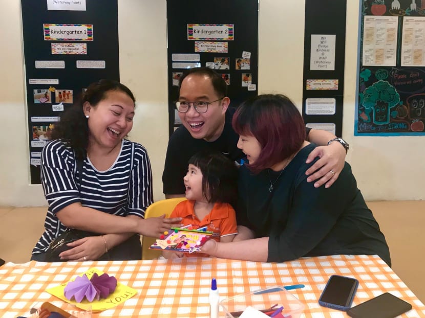 Four-year-old Charlotte, her parents Ms Ivy Mok and Mr Dareen Mok, and Ms Misiyatun, the family’s domestic helper, who is from Indonesia.