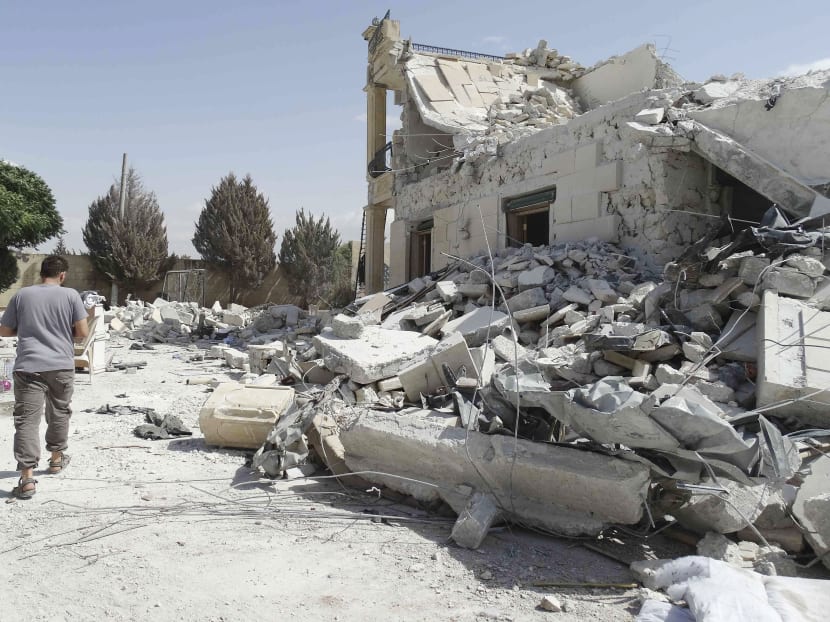 A militant base damaged by US-led air strikes in Aleppo, Syria. As the US attacks militant strongholds, hundreds of South-east Asians have gone to fight for the Islamic State. Photo: Reuters
