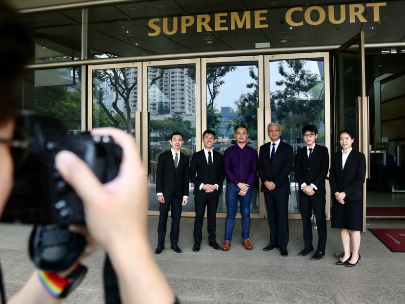 Mr Bryan Choong (third from left) seen outside the Supreme Court posing for a photo with his lawyers on Nov 13, 2019. He is one of three men who have mounted challenges to Section 377A of the Penal Code.