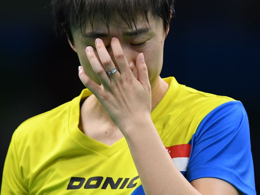 Paddler Feng Tian Wei reacts between points against Japan's Ai Fukuhara in their women's singles quarter-final table tennis match at the Riocentro venue during the Rio 2016 Olympic Games in Rio de Janeiro. Photo: AFP