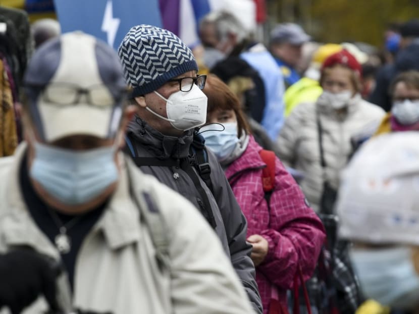 People wear face masks at the Hakaniemi Sunday market in Helsinki, Finland, on Nov 1, 2020, amid the novel coronavirus Covid-19 pandemic.