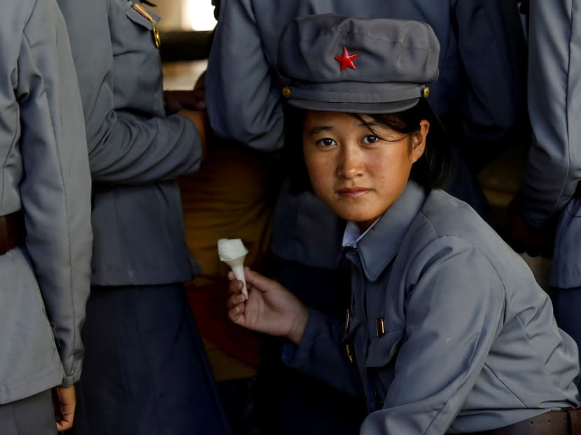 A soldier eats ice cream as she visits a zoo in Pyongyang, North Korea, in September 2018. The author says that 2018 has been another relatively good year for a slowly but steadily growing North Korean economy that is still yet unable to fully use its potential.