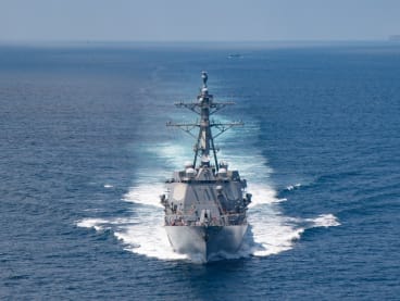 In this handout image courtesy of the US Navy taken on Aug 27, 2021, the AI Arleigh-burke class guided-missile destroyer USS Kidd (DDG 100) transits the Taiwan Strait during a routine transit. 