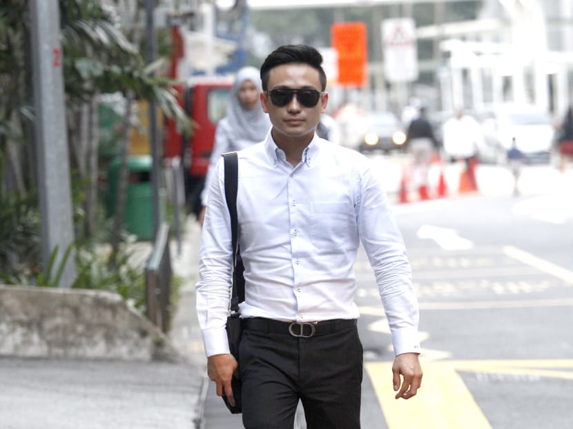 Kuan Chow Sheng, a property agent, is charged for breaching the Do Not Call (DNC) requirements under the Personal Data Protection Act, Sept 24, 2014. Photo: Wee Teck Hian
