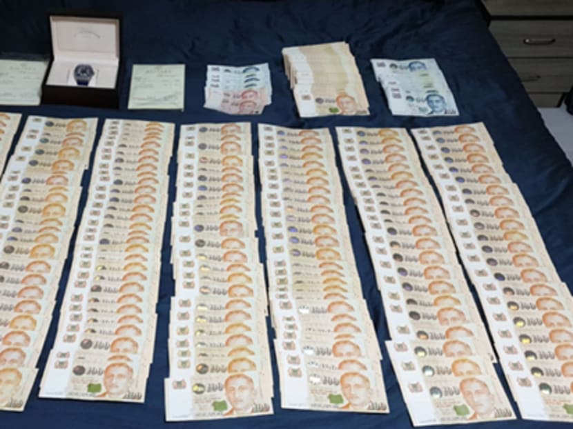 The police seized two watches and more than S$81,000 in cash when they arrested the suspect on May 26, 2020.