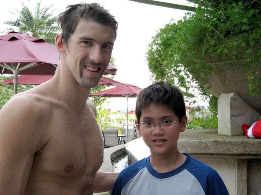A young Joseph Schooling with American swimming legent Michael Phelps taken before the 2008 Olympics. PHOTO: May Schooling