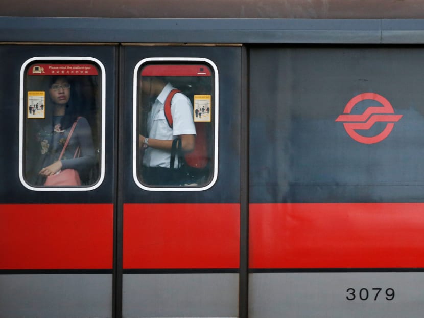 People stand at the window of an SMRT train cabin in Singapore on Tuesday (July 19), 2016. Photo: Reuters