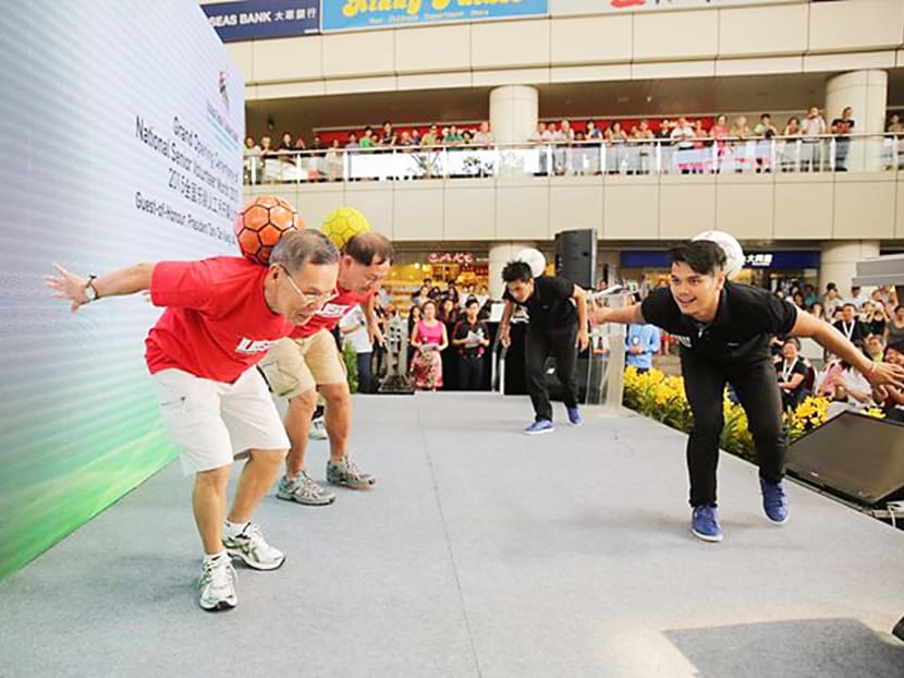 Senior Volunteers from RSVP Singapore performed at the opening ceremony, including this group of three seniors who joined members of the Urban Street Team for a Freestyle Football performance. Photo: Tony Tan/Facebook