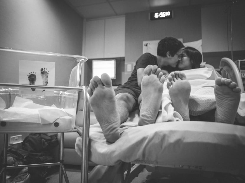 The author took this photo of a couple holding their stillborn baby in a Singapore hospital in 2019.