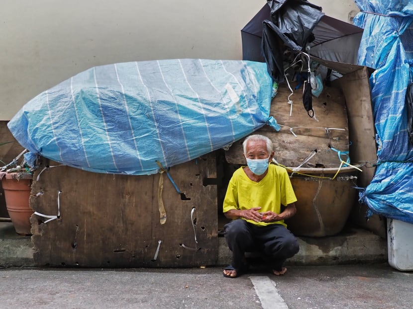 Dishwasher Pang Jee Tang next to his makeshift “home” along an alley in Purvis Street.