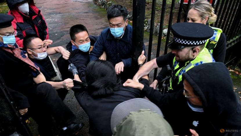 British police probe beating of protester on China consulate grounds British police probe beating of protester on China consulate grounds