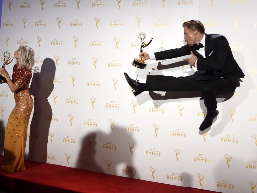 Derek Hough, right, and Julianne Hough, co-winners of the award for Outstanding Choreography for "Dancing with the Stars," pose in the press room at the Creative Arts Emmy Awards at the Microsoft Theater on Sept 12, 2015, in Los Angeles. Photo: Invision via AP