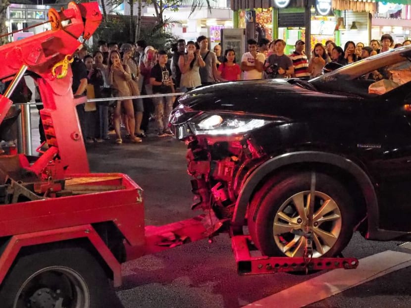 The car involved in the fatal accident being towed away. Chong Kim Hoe, 66, pleaded guilty to one count under the Road Traffic Act for dangerous driving causing death.