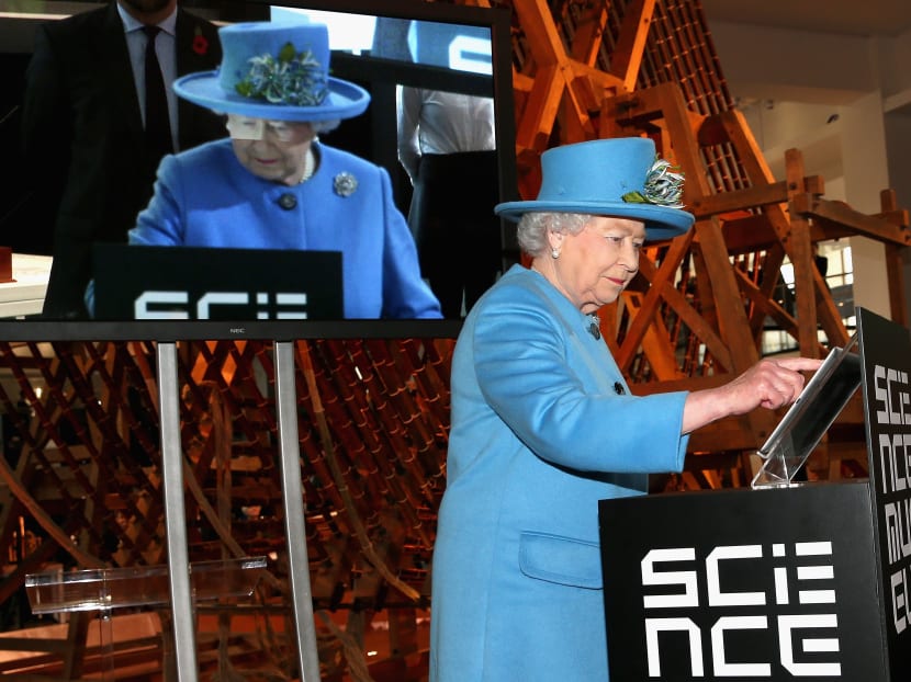 Britain's Queen Elizabeth II sends the first royal tweet under her own name to declare the opening of the new Information Age Galleries at the Science Museum, South Kensington, London, Oct 24, 2014. Photo: AP