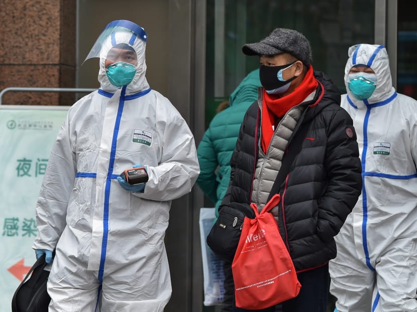 Medical staff wearing clothing to protect against a previously unknown virus walk outside a hospital in Wuhan on January 26, 2020, a city at the epicentre of a viral outbreak that has killed at least 56 people and infected nearly 2,000. Medical staff wearing clothing to protect against a previously unknown virus walk outside a hospital in Wuhan on January 26, 2020, a city at the epicentre of a viral outbreak that has killed at least 56 people and infected nearly 2,000.