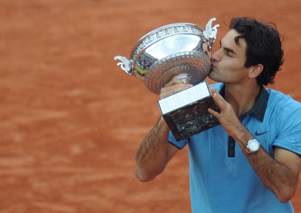In this file photo taken on June 7, 2009 Swiss Roger Federer kisses the trophy after winning against Swedish player Robin Soderling during their French Open tennis men's final match at Roland Garros Stadium in Paris. In this file photo taken on June 7, 2009 Swiss Roger Federer kisses the trophy after winning against Swedish player Robin Soderling during their French Open tennis men's final match at Roland Garros Stadium in Paris.