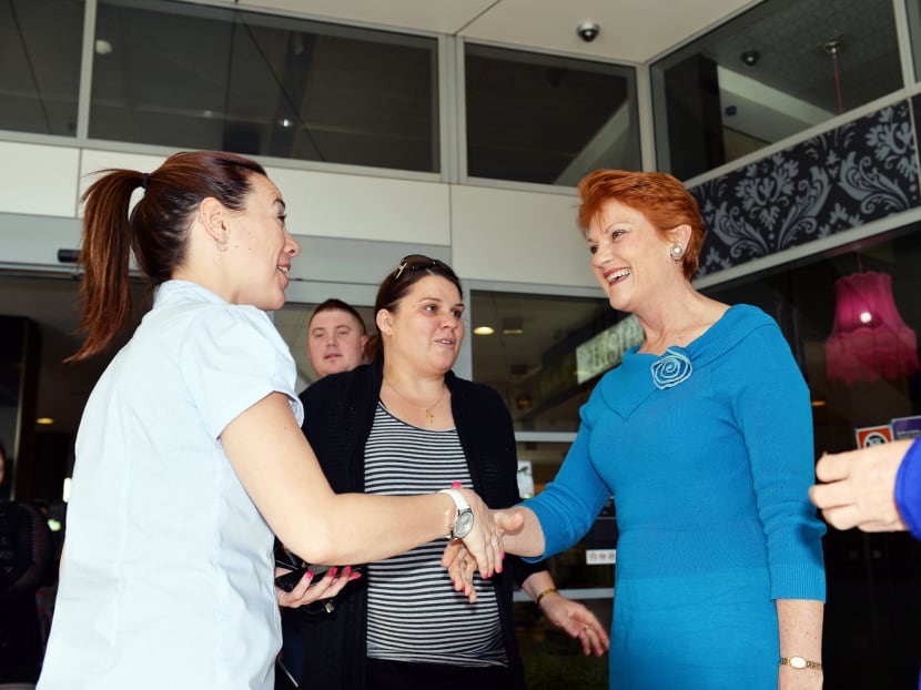 One Nation Party founder Pauline Hanson (right) campaigning in Sydney in 2013. One Nation is tipped to win seats in state polls in Western Australia next month, and Queensland later in the year. Photo: AFP