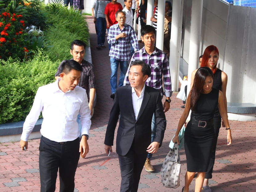 (Left to right) Tan Ye Peng, John Lam and Serina Wee, arriving at the State Court as the City Harvest case resumes, on July 14, 2014. Photo: Ernest Chua