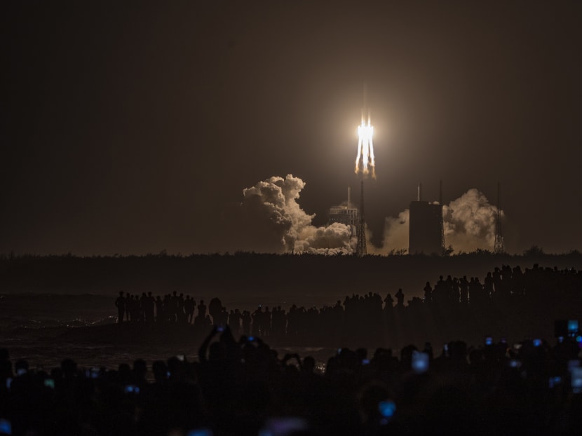 A Long March 5 rocket carrying China's Chang'e-5 lunar probe launches from the Wenchang Space Center on China's southern Hainan Island on Nov 24, 2020, on a mission to bring back lunar rocks, the first attempt by any nation to retrieve samples from the moon in four decades.