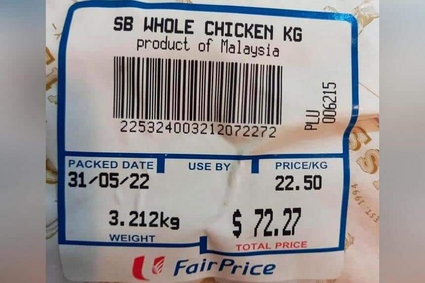 A photograph of a price label showing "SB Whole Chicken" on sale at S$72.27 for a 3.21kg packet at NTUC FairPrice supermarket. A photograph of a price label showing "SB Whole Chicken" on sale at S$72.27 for a 3.21kg packet at NTUC FairPrice supermarket.