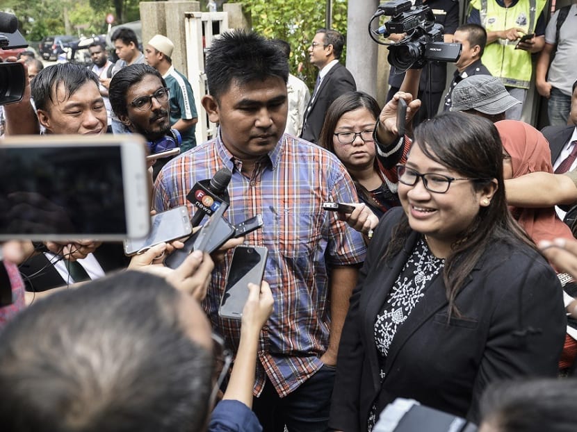 Firefighter Muhammad Adib Mohd Kassim’s brother, Mohd Asraf Mohd Kassim (left) and lawyer representing Adib's family Shazlin Mansor (right) speak during a press conference outside the Shah Alam court complex, Sept 27, 2019.