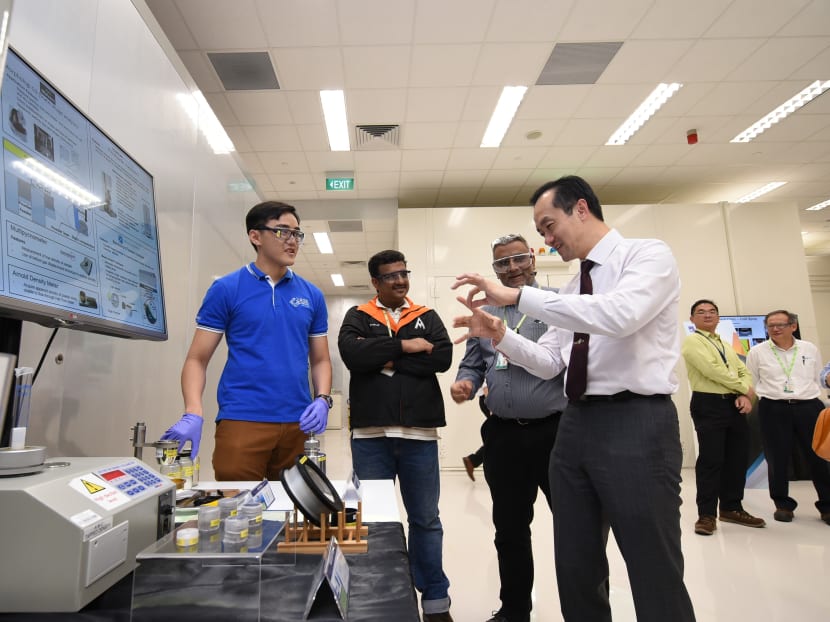 Senior Minister of State, Ministry of Trade & Industry and National Development Dr Koh Poh Koon (right) touring the Industrial Additive Manufacturing Facility (IAMF) on Friday (Sept 8). He was also briefed on the various additive manufacturing technologies made available at the Facility. Photo: A*Star
