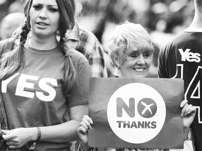 Yes and No supporters for the Scottish referendum in  Edinburgh last week. The separate Scottish identity has deep-seated origins, but more could have been done by successive UK governments to minimise divisiveness. 
Photo: AP