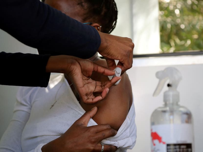 A healthcare worker administers the Johnson and Johnson Covid-19 vaccination to a woman in Houghton, Johannesburg, South Africa on Aug 20, 2021. 