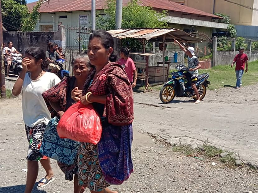 Women are seen evacuating, as a 7.4-magnitude earthquake struck eastern Indonesia triggering a tsunami warning in Maumere, East Nusa Tenggara, Indonesia on Dec 14, 2021. Women are seen evacuating, as a 7.4-magnitude earthquake struck eastern Indonesia triggering a tsunami warning in Maumere, East Nusa Tenggara, Indonesia on Dec 14, 2021.