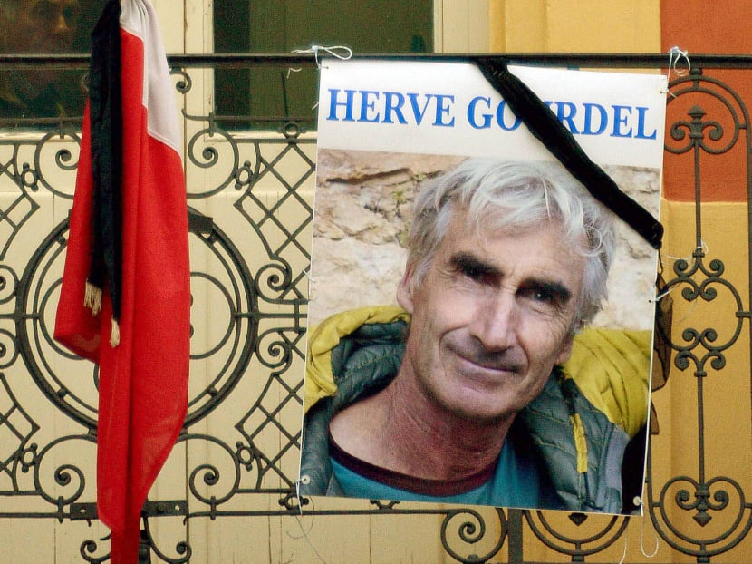 A portrait of 
Mr Herve Gourdel is placed near a French flag outside the town hall in Saint-Martin-Vesubie, France, following his beheading by Algerian militants linked to the Islamic State group. PHOTO: REUTERS