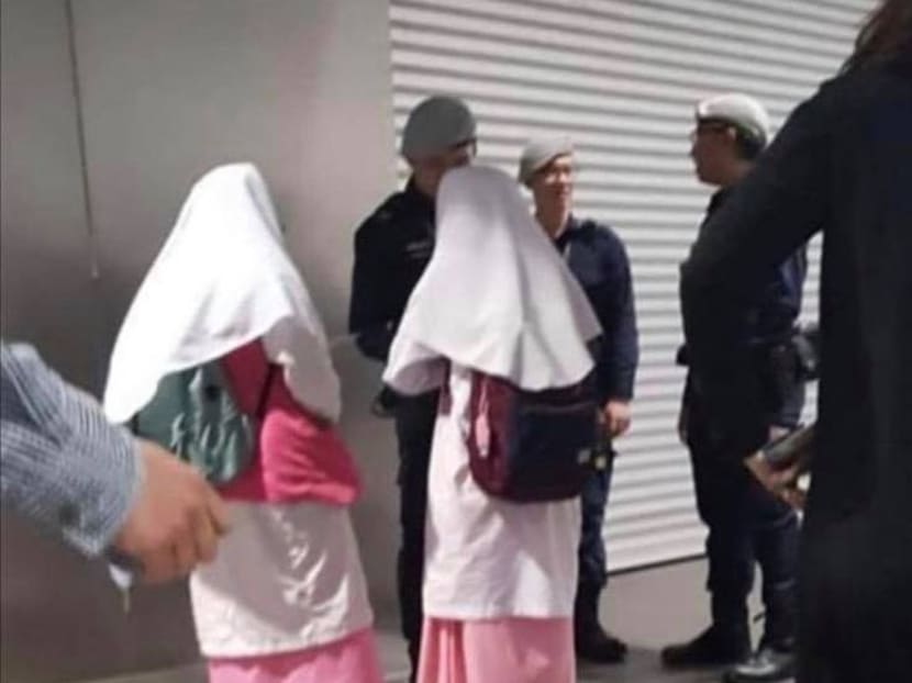 The police said that TransCom officers in a photo circulating online were talking to two madrasah students about the Riders-on-Watch scheme.