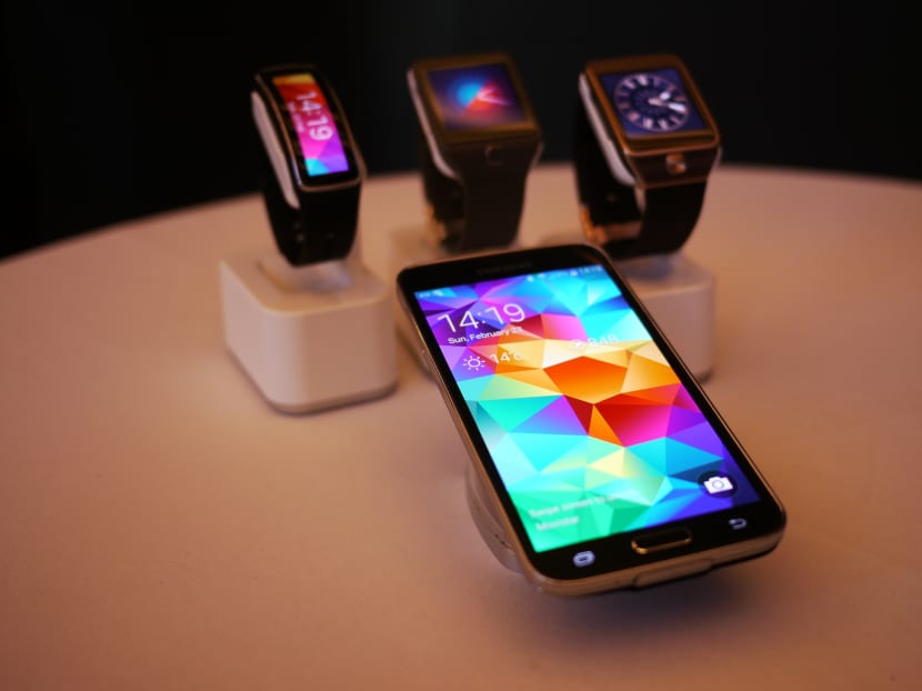 The Samsung Galaxy S5, together with the Gear Fit, Gear 2 Neo and the Gear 2. Photo: June Yang