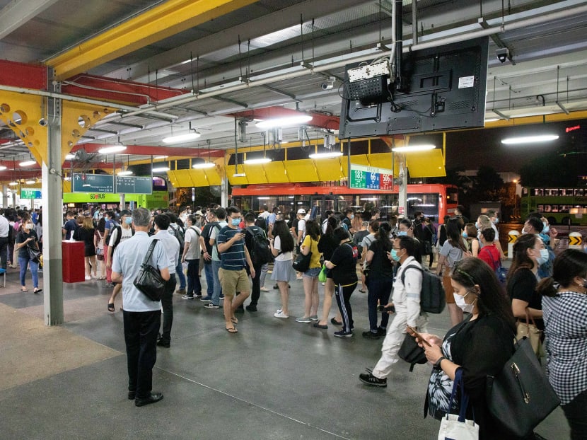 Commuters queuing for free shuttle bus at Jurong East bus interchange on Oct 14 when a fault with the power cables and a circuit breaker along the Tuas West Extension caused a massive train disruption.
