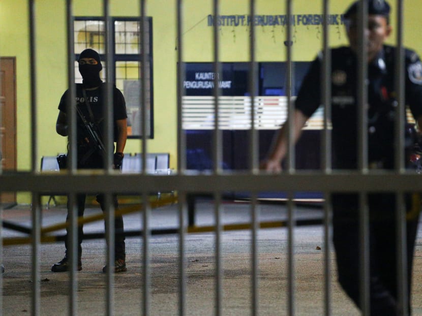 Police stand guard at the gate of the morgue at Kuala Lumpur General Hospital where Kim Jong Nam's body is held for autopsy in Malaysia, on Feb 21, 2017. Photo: Reuters