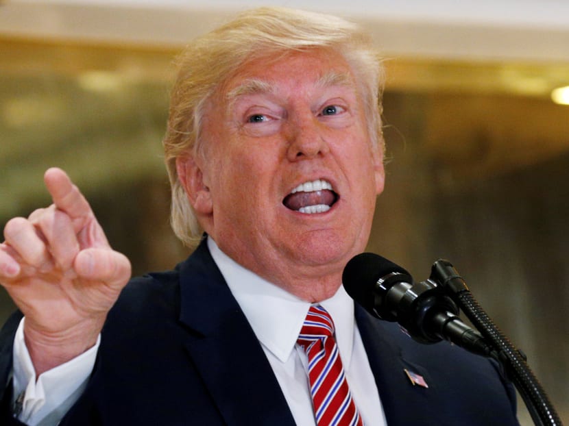 US President Donald Trump answers questions about his response to the violence, injuries and deaths at the "Unite the Right" rally in Charlottesville as he talks to the media in the lobby of Trump Tower. Reuters file photo