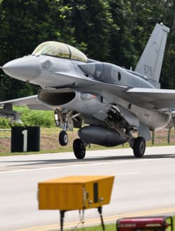 An F-16 plane of the Republic of Singapore Air Force landing on a public road in Lim Chu Kang during a media preview in 2016.