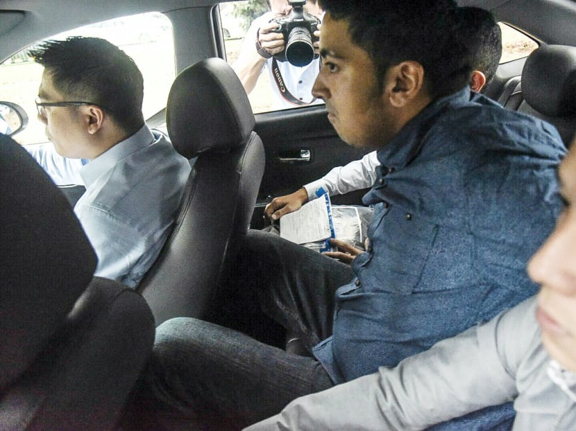 British national Yogvitam Pravin Dhokia, 27, who ran across the track at the Singapore Grand Prix, arrives at the State Court on Tuesday (Sep 22) to be charged. Photo: Calvin Oh