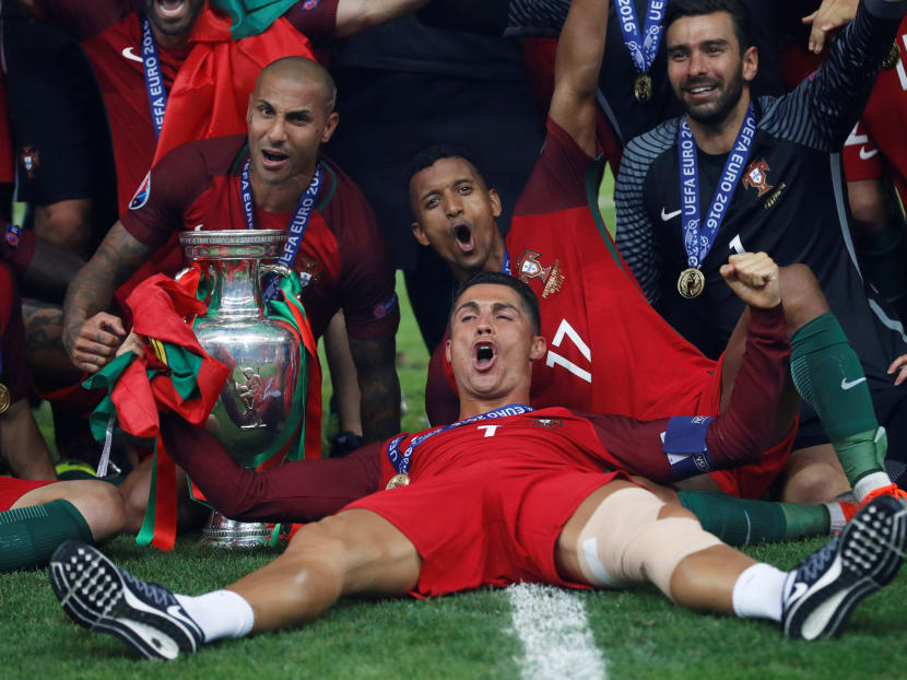 Portugal's Cristiano Ronaldo celebrates with Ricardo Quaresma, Nani, and Rui Patricio after winning Euro 2016. Photo: Reuters