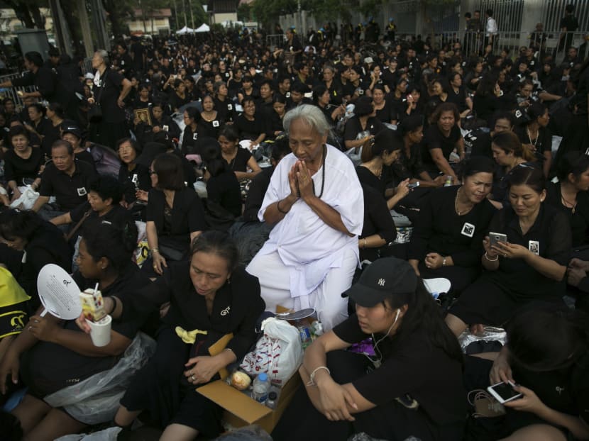 Thai mourners praying for the late King Bhumibol Adulyadej during as the Royal Cremation ceremony in October. Thailand has to reconcile the overlapping forces of the Cold War and the 21st Century that now harbour conflicting interests and preferences through compromise and mutual accommodation.  Photo: AP