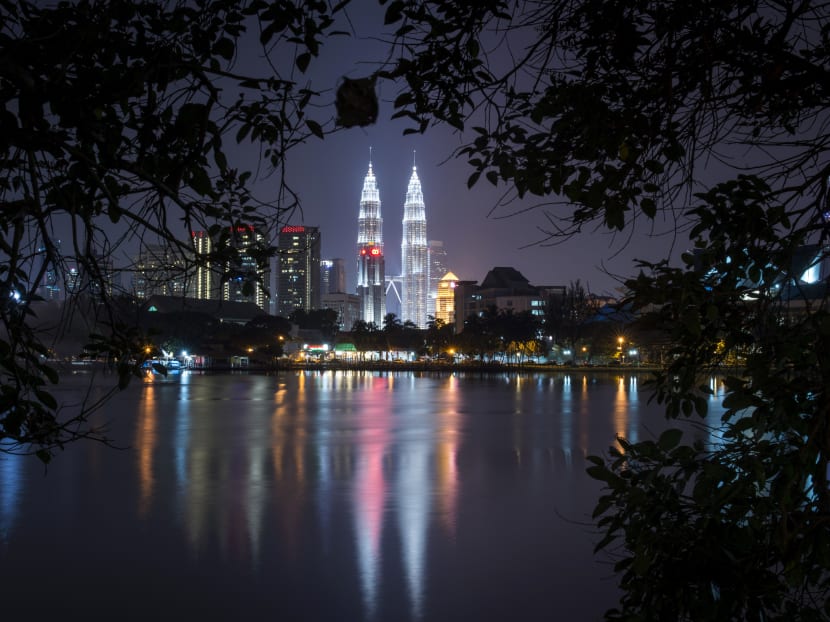 Malaysia's landmark Petronas Twin Towers illuminates the night skyline in Kuala Lumpur. Photo: AP