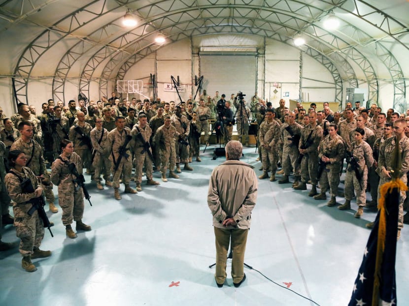 In this Dec 8, 2013, file pool photo, Defense Secretary Chuck Hagel speaks with U.S. troops at Camp Bastion, Afghanistan. Photo: AP