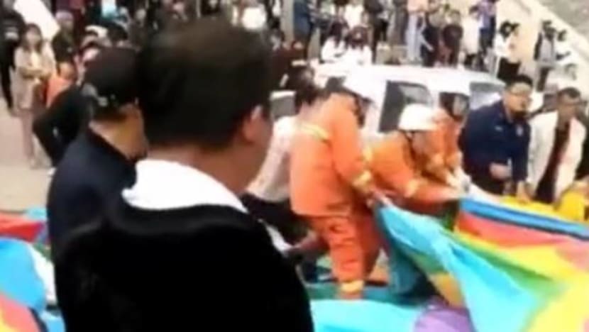 Two children dead after tornado tips bouncy castle in China Two children dead after tornado tips bouncy castle in China