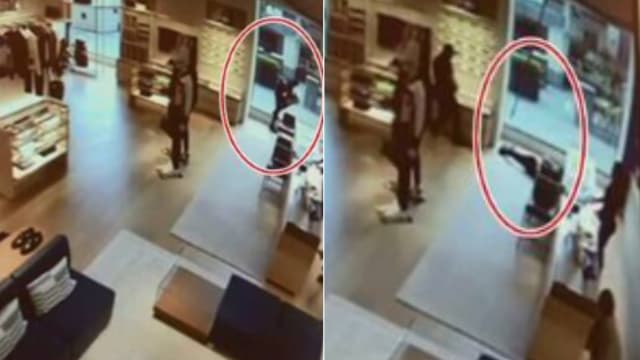 美国乌龙小偷精品店偷包包  直撞落地玻璃当场昏迷被捕