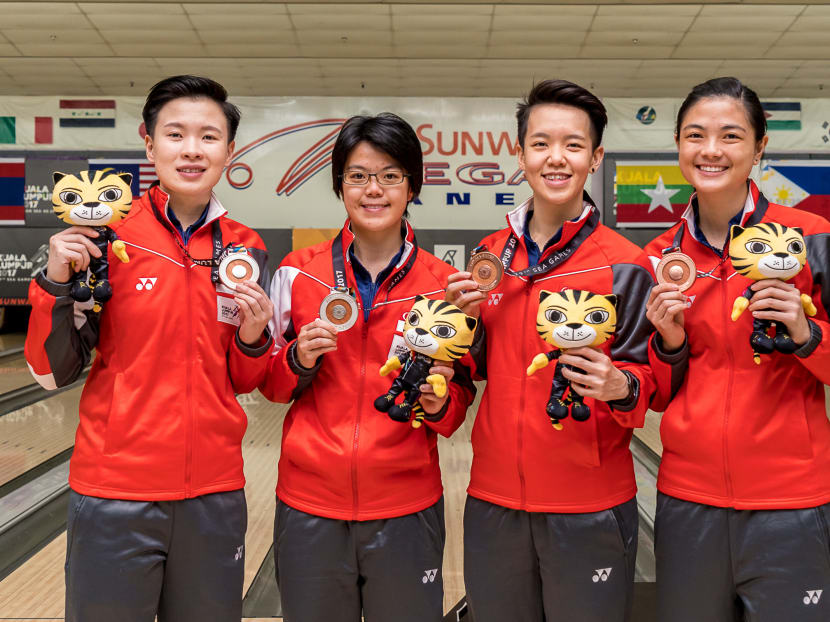 Singapore's New Hui Fen (left) and Cherie Tan (second from left) won the women's doubles silver while teammates Shayna Ng and Daphne Tan (right) finished third. Photo: Sport Singapore / Randi Ang