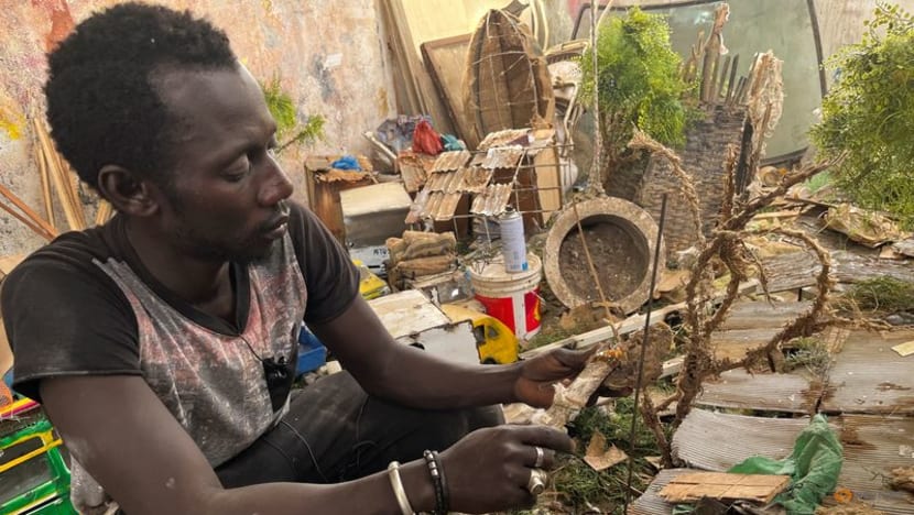 Dark times inspire Dakar artist at long-awaited African art biennale